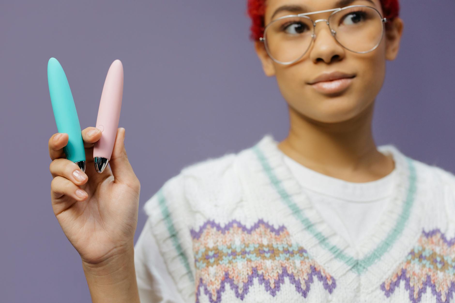 Woman holding lemon clitoral vibrators demonstrating clitoral pleasure without penetration